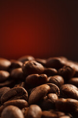 coffee beans on a dark background with a red highlight on the background, coffee beans close-up for a coffee shop