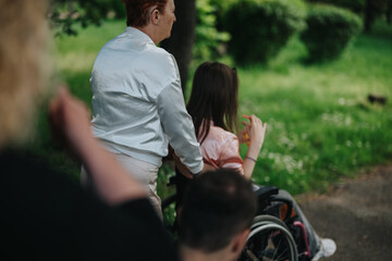 Compassionate interaction depicted as an individual guides a wheelchair user along a peaceful park...