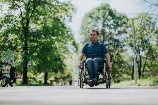 A cheerful person in a wheelchair experiencing independence and enjoying nature in a sunny park, embodying resilience, positivity, and inclusivity.