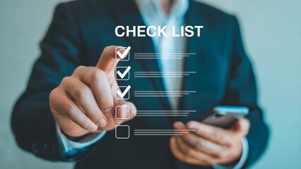 Businessman marking checklist items with a touch, achieving goals and completing tasks efficiently