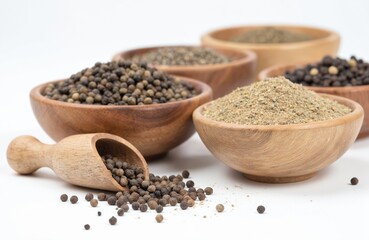 Rustic wooden bowls filled with whole peppercorns, ground pepper. Wooden scoop overflows with peppercorns. Natural seasoning, spice for cooking, culinary arts, restaurant presentations. High-quality