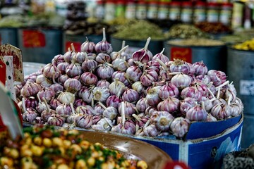 Vibrant garlic bulbs in a market setting.