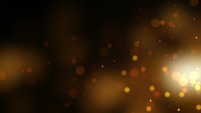Abstract animation loop glow  orange gold bokeh particles flow from left to right on black background. 4K 3D seamless looping gold orange  bokeh particles dust fly in the air. 