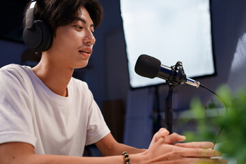 Female podcaster interviewing a guest in a recording studio