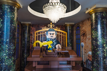 Fototapeta premium Life size LEGO goblin banker display inside Gringotts styled interior. London, UK, 2 June 2024