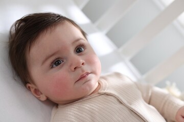 Bedtime. Cute little baby in crib at home