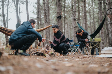A group of friends gathering in a forest on a casual winter day, enjoying an outdoor picnic with...