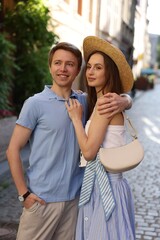 Lovely couple walking together on city street