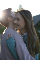 Lovely couple walking together in park on sunny day