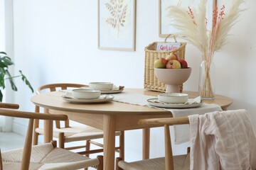 Beautiful table setting, chairs and decor in dining room. Interior design