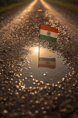 Quiet Morning Reflection of Indian Flag in Water Puddle with Dew-Covered Ground and Rising Sun