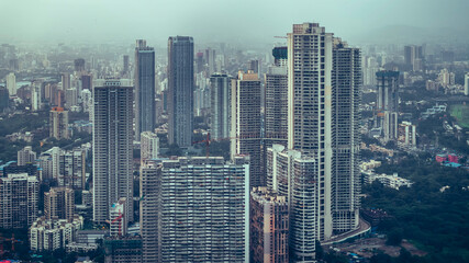 Mumbai, Maharashtra, India-12 July 2025: Aerial cinematic image of Mumbai during the monsoon season. Ideal for themes like residential buildings and urban cityscapes.