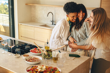 A woman joyfully shares her pregnancy announcement with her close friends