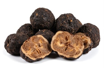 Whole and sliced black truffles with intricate textured interiors against a clean white background. These gourmet fungi, often mistaken for chocolate, offer a rich, earthy flavor for fine dining.