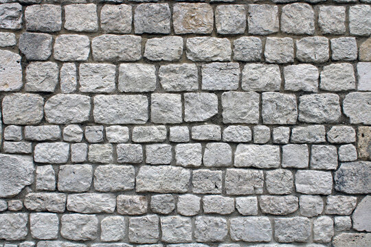 Mur de maison en pierre blanche