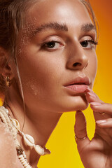Natural summer beauty shines with seashell elegance in vibrant studio setting