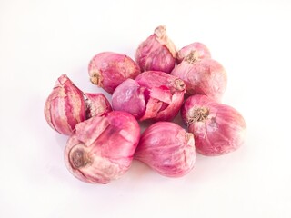 Group of red shallots on white background