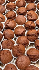 Cupcakes close-up Background. mini maffins on a bakery