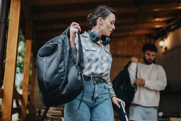 Two students ready for an outdoor adventure, carrying backpacks and wearing headphones, showcasing a blend of casual style and excitement for travel and exploration.