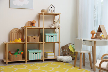Stylish playroom with toys and furniture. Interior design