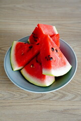 Fresh Watermelon Slices in Bowl on Wooden Surface