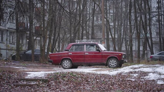 Old 'Lada' in a Snow-Covered Courtyard Trap