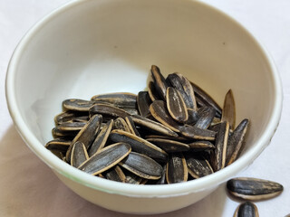Roasted sunflower seeds in black and white striped shells, ready to be enjoyed as a healthy snack.