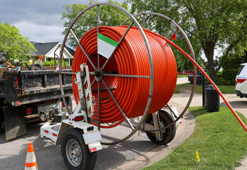 Cable drum for laying internet fiber optic cables in residential neighborhood