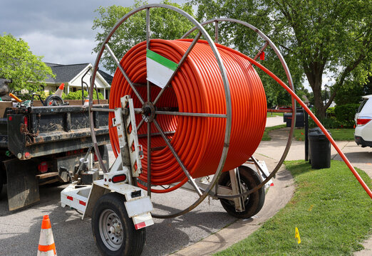 Cable drum for laying internet fiber optic cables in residential neighborhood