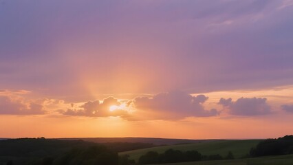 Obraz premium Sunset Over Rolling Hills with Dramatic Purple and Orange Sky