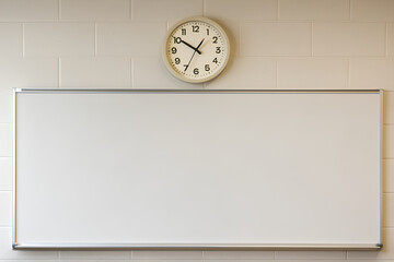 Classroom with Clock and Whiteboard, Possibly for Medical Training or Learning Environment