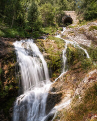 Water cascades down the mountain and through a stone tunnel just outside Gavarnie in the French Pyrenees