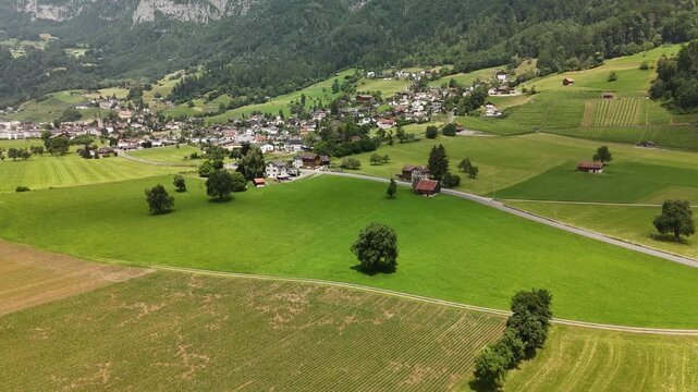 Scenic Aerial View of Rural Countryside and Alpine Landscape Near Flums, Berschis and Walenstadt, Switzerland &ndash; Drone Footage