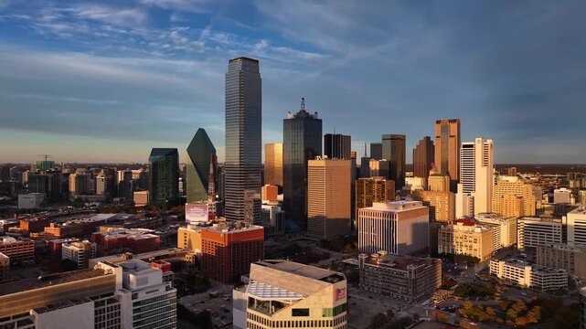 Aerial view of the Dallas skyline presenting modern buildings, skyscrapers, and architectural marvels bathed in warm light, Dallas, Texas, United States.