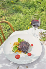 BBQ pork rib with braised cabbage and smashed cucumbers, bright natural light, overhead plate composition