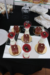 Cakes, cupcakes and pastries on a candy bar. Sweet table.