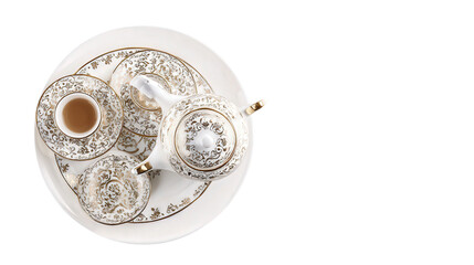 Elegant Tea Set on White Plate: A flat lay of an elegant tea set with teapot, cups, and saucers, isolated on a Transparent background, PNG file.