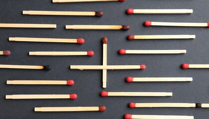 Matches arranged in a plus shape