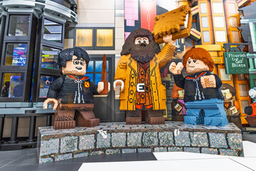 Fototapeta premium Giant Lego sculptures of wizarding heroes on display in colorful toy store. London, UK, 2 June 2024