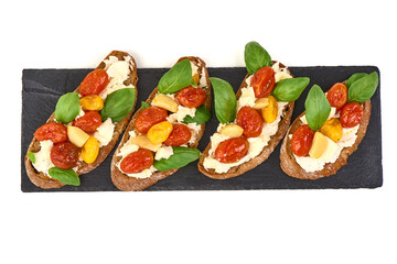 Bruschetta with Tomatoes, cream Cheese, Basil, Lettuce, isolated on white background