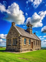 Fototapeta premium Ancient Stone School Building Under Clear Blue Sky With Few White Clouds