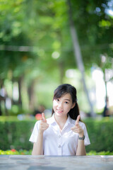 The cute college student with an Asian look spent the afternoon posing for photos on the university...