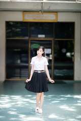 A college student with a cute Asian look participated in a university fashion project, posing for...