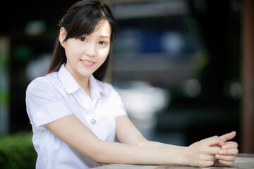 As a college student with an Asian look, she enjoyed posing for photos at university events,...