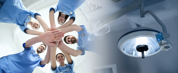 Doctors holding hands together and lamp in surgery room, double exposure. Banner design