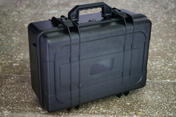 Heavy-duty protective box suitcase designed to safeguard fragile items like cameras, instruments, jewelry, and secret gear against impacts and moisture. Photo