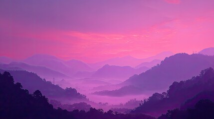 Obraz premium Purple And Pink Sunset Over Misty Mountains