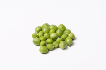 A pile of fresh green peas on a white background. Isolated