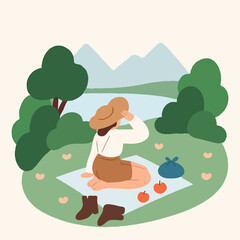 Fototapeta premium Woman sitting on picnic blanket enjoying nature by the lake 