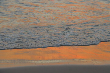 Sea Water Painted in Red and Orange Sunset Colors